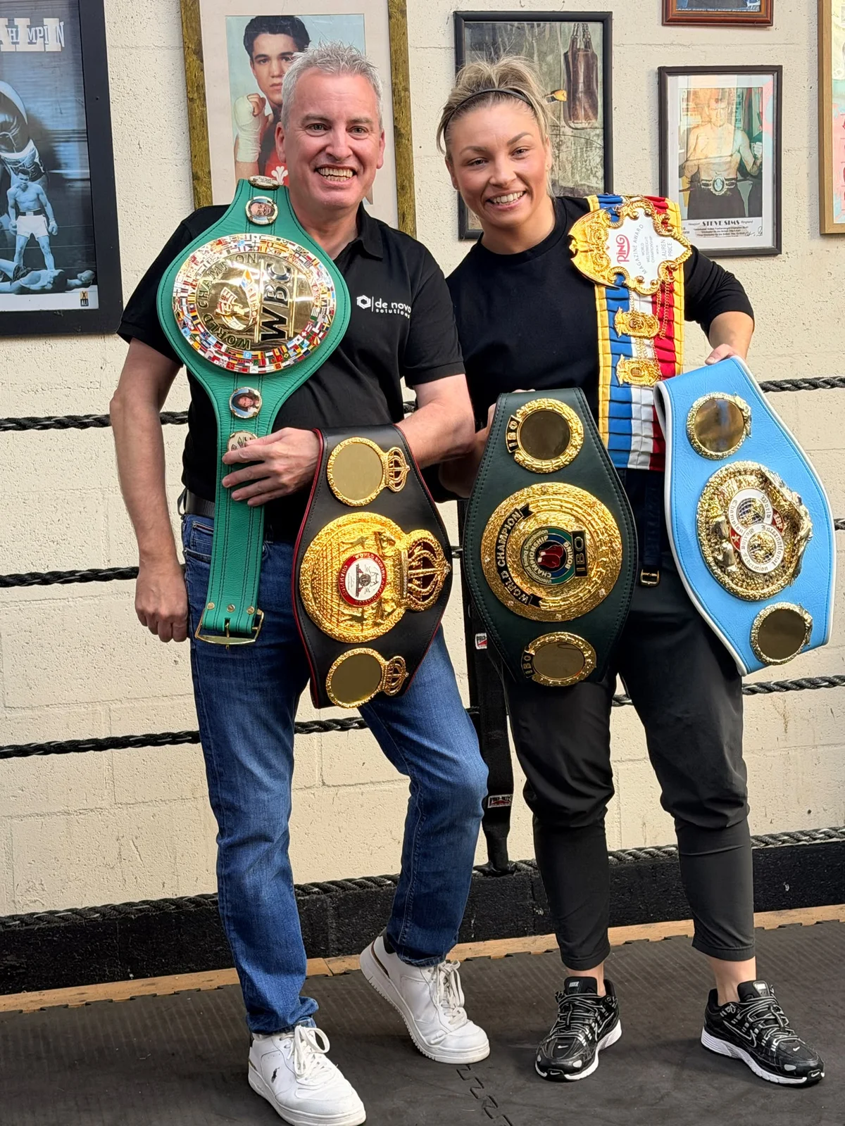 Lauren Price MBE and Mark Sweeny with championship belts