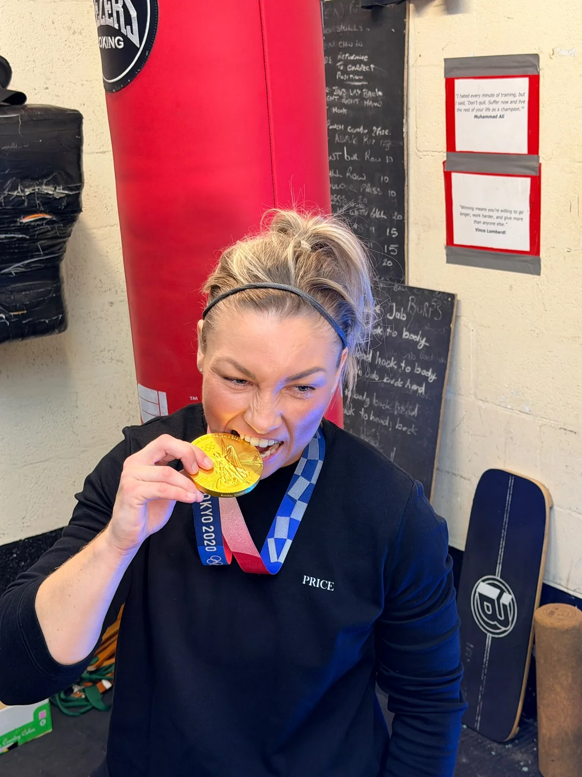 Lauren Price MBE celebrating her Olympic gold medal