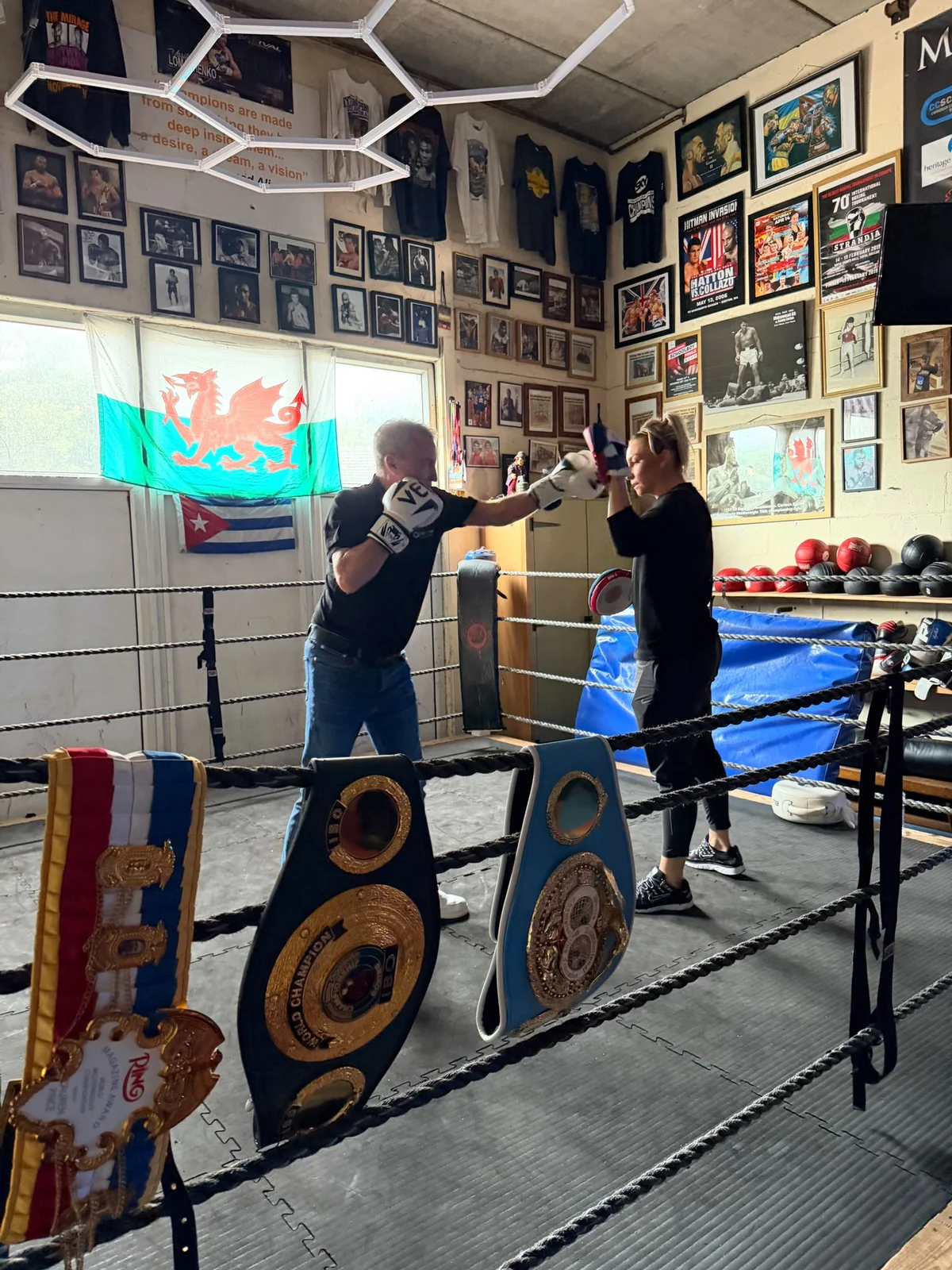 Mark Sweeny practising with Lauren Price MBE on the pads