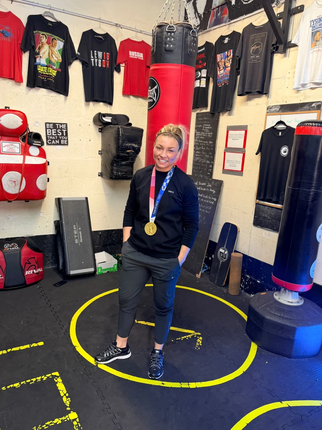 Lauren Price MBE with her Olympic gold medal at Pontypool Boxing Club